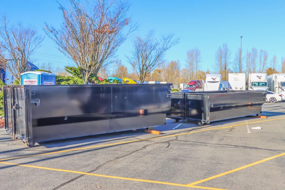 Professional dumpster rental service with roll-off container on residential driveway in Eidson Road